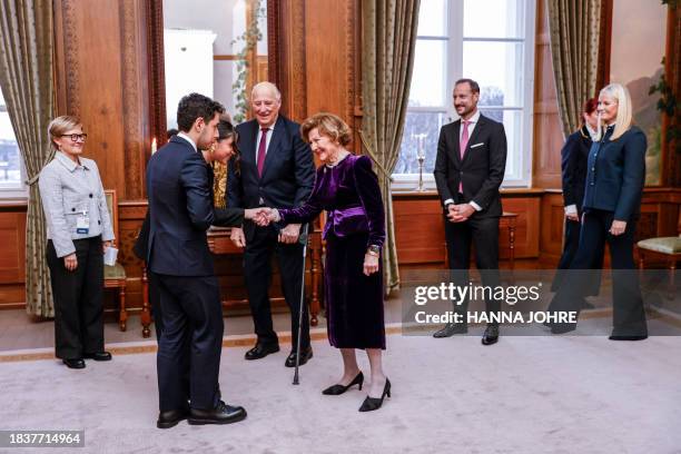King Harald and Queen Sonja receive Kiana and Ali Rahmani, children of 2023 Nobel Peace Prize laureate Narges Mohammadi, for an audience at the...