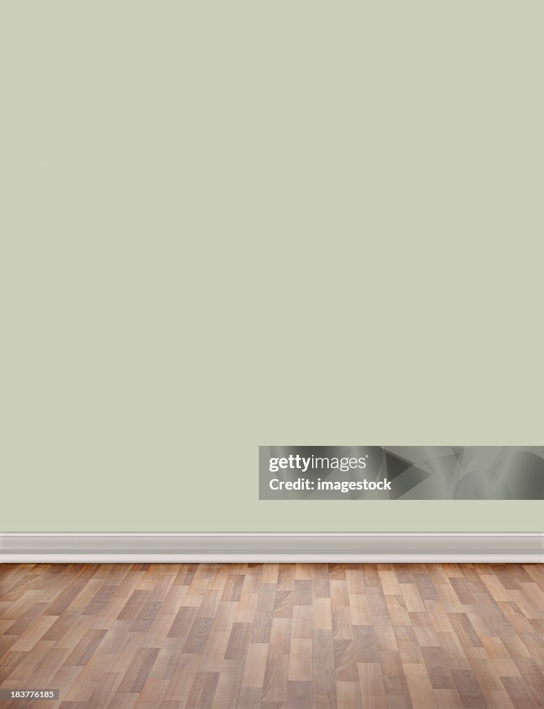 Empty room with wooden floor and green wall