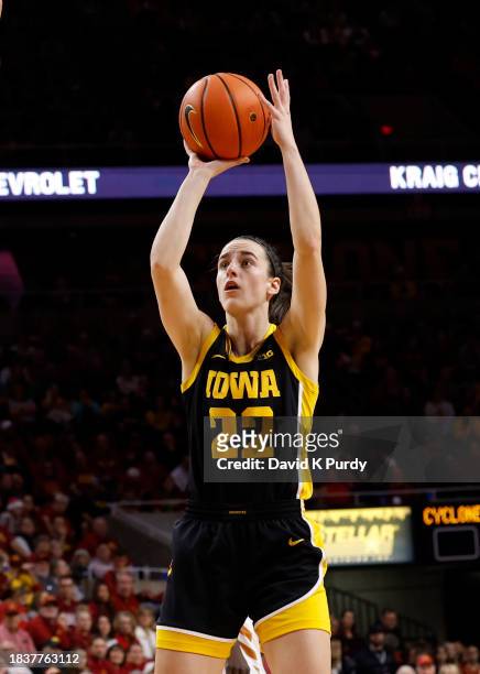 Caitlin Clark of the Iowa Hawkeyes shoots the ball in the first half of play at Hilton Coliseum on December 6, 2023 in Ames, Iowa. They Iowa Hawkeyes...