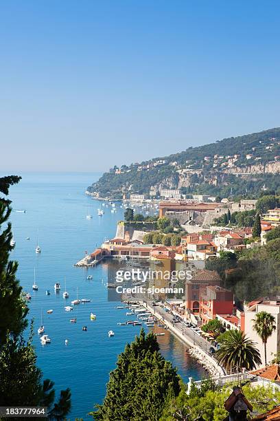 villefranche-sur-mer filled with boats off the shoreline - south france stock pictures, royalty-free photos & images