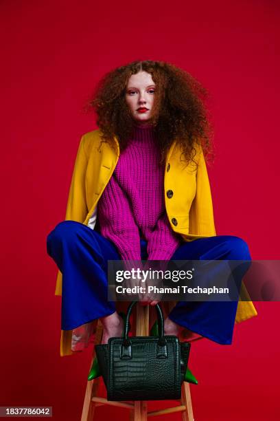 fashionable young woman wearing colorful outfit - yellow purse stock pictures, royalty-free photos & images
