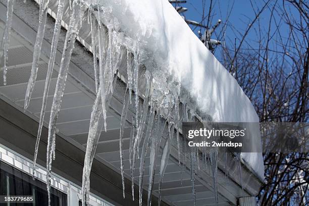 icicles on the roof - icicles stock pictures, royalty-free photos & images