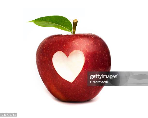 red apple with a heart symbol cut out - apple heart stock pictures, royalty-free photos & images