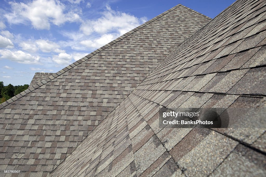 New Shingled Roof with Blue Sky Background