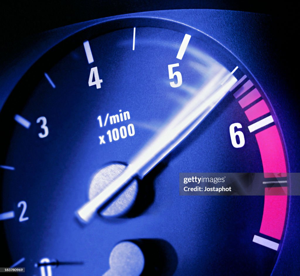 Close up photo of a tachometer  needle moving