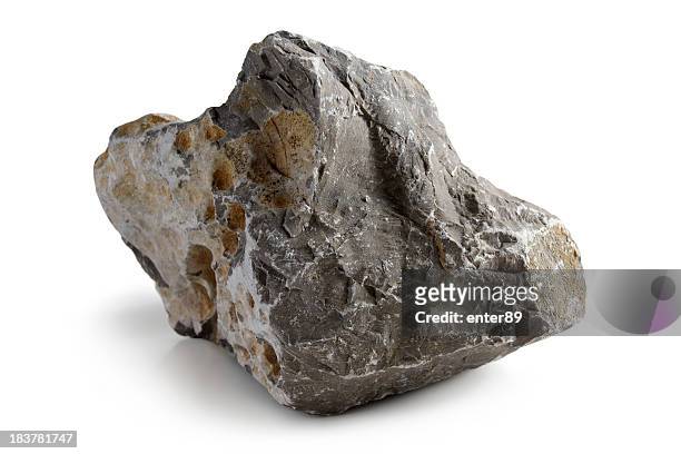 lopsided grey stone with rough edges - rock stock pictures, royalty-free photos & images