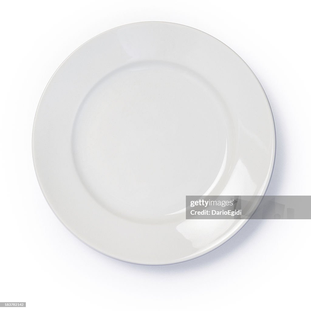 Empty white dinner plate on white background