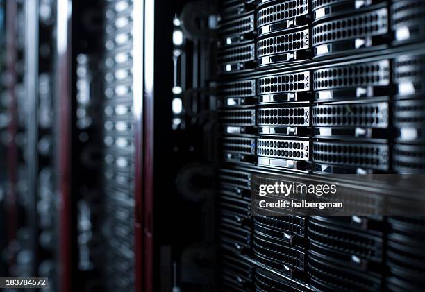 rackmounted servers in a datacenter - storage stock pictures, royalty-free photos & images