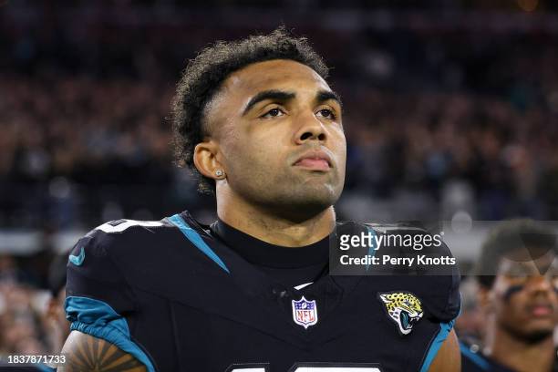 Christian Kirk of the Jacksonville Jaguars looks on from the sideline during the national anthem prior to an NFL football game against the Cincinnati...