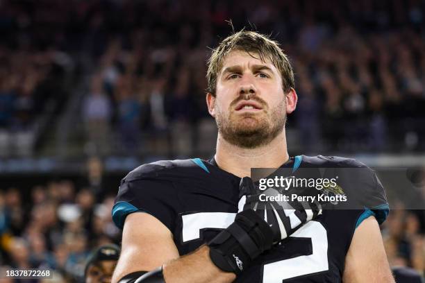 Walker Little of the Jacksonville Jaguars looks on from the sideline during the national anthem prior to an NFL football game against the Cincinnati...