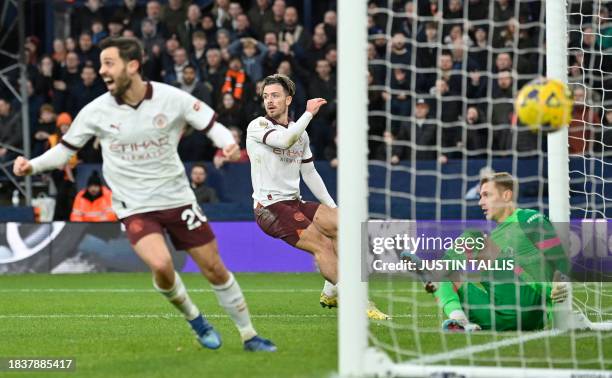 Manchester City's English midfielder Jack Grealish celebrates scoring his team second goal during the English Premier League football match between...