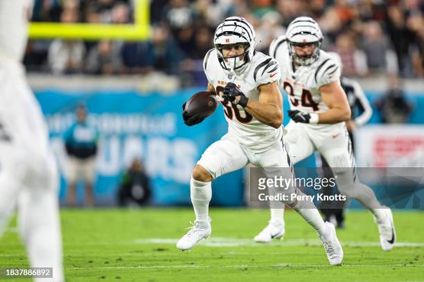 Chase Brown of the Cincinnati Bengals runs the ball during an NFL football game against the Jacksonville Jaguars at EverBank Stadium on December 4,...