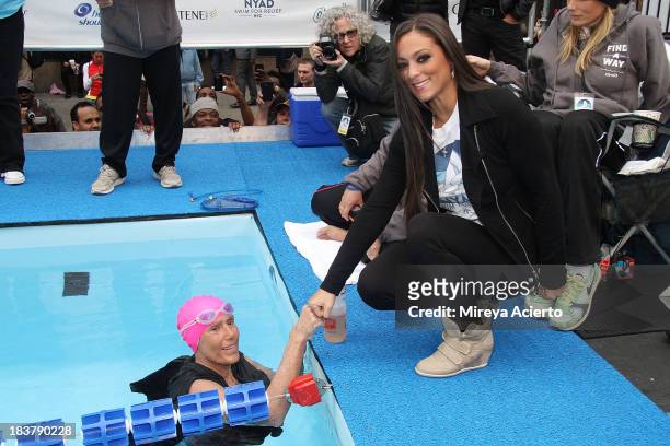 Diana Nyad and Sammi "Sweetheart" Giancola attend "Swim for Relief" Benefiting Hurricane Sandy Recovery at Herald Square on October 9, 2013 in New...