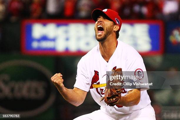 Adam Wainwright of the St. Louis Cardinals celebrates defeating the Pittsburgh Pirates 6 to 1 in Game Five of the National League Division Series at...