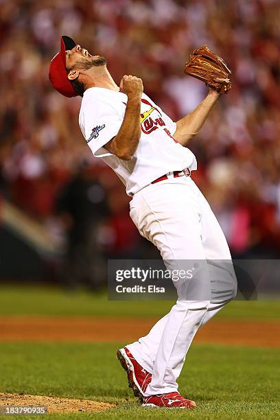 Adam Wainwright of the St. Louis Cardinals celebrates defeating the Pittsburgh Pirates 6 to 1 in Game Five of the National League Division Series at...