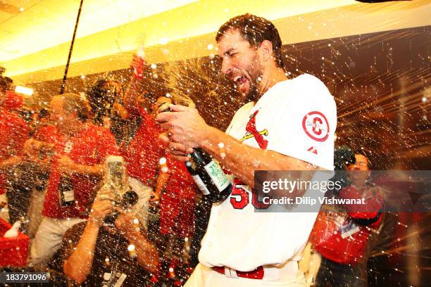 Adam Wainwright of the St. Louis Cardinals celebrates in the locker room after their 6 to 1 win over the Pittsburgh Pirates in Game Five of the...