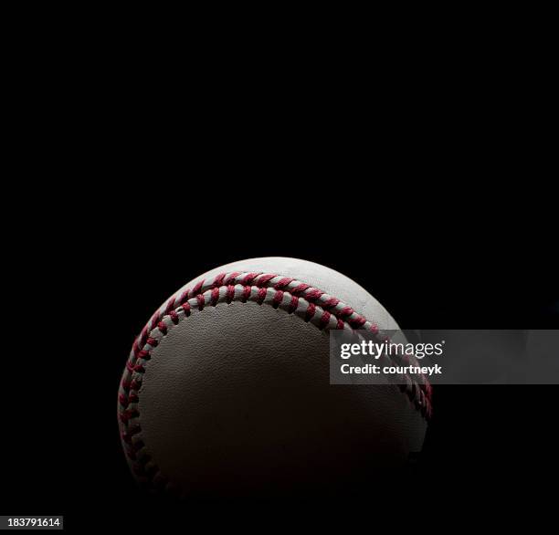 backlit baseball shot on a black background - black lace background stock pictures, royalty-free photos & images