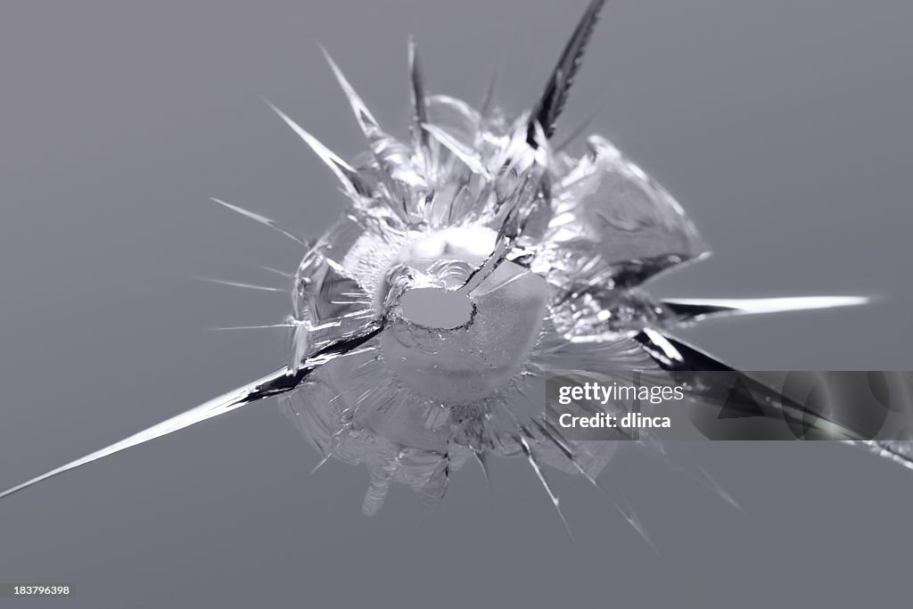 Close-up of some shattered glass on gray background