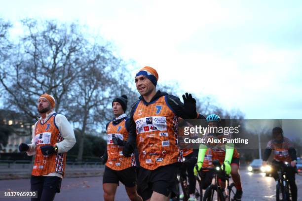 Kevin Sinfield waves to supporters as he Finishes His Ultra 7 In 7 In 7 Marathon Challenge at The Mall In London on December 07, 2023 in London,...