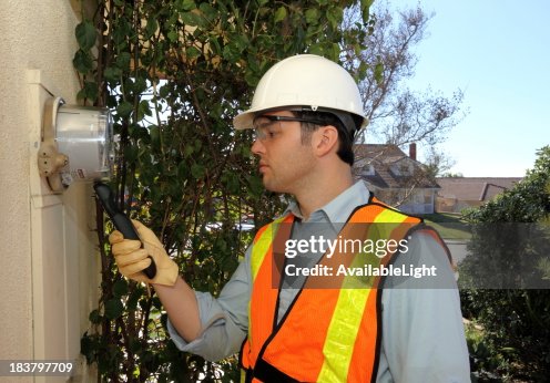 Smart Meter Technician Calibrates Device Smart Meter Technician Calibrates Device