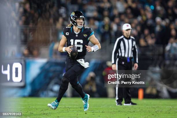 Trevor Lawrence of the Jacksonville Jaguars scrambles out of the pocket during an NFL football game against the Cincinnati Bengals at EverBank...