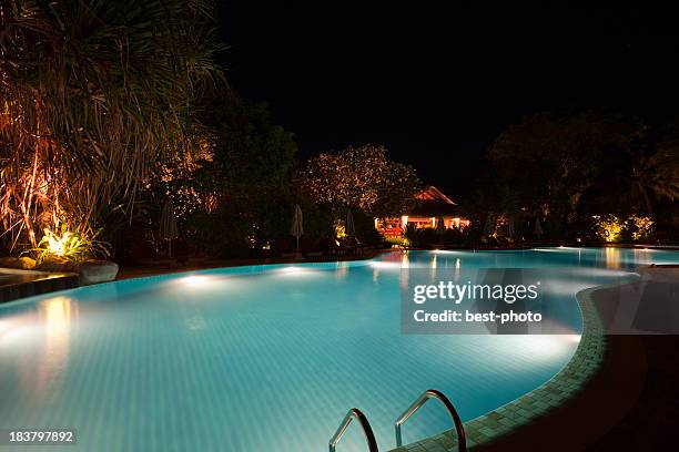 swimming pool at night - bestphoto stock pictures, royalty-free photos & images