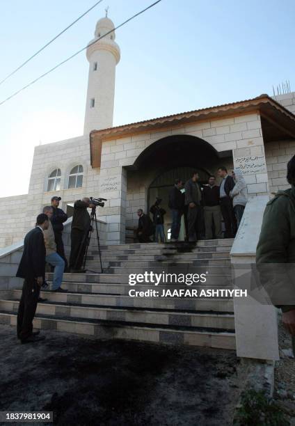 Palestinians inspect damage to a mosque in the West Bank village of Birqin near Nablus on December 7, 2011 after unknown attackers, believed by...