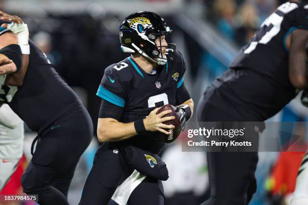 Beathard of the Jacksonville Jaguars scrambles out of the pocket during an NFL football game against the Cincinnati Bengals at EverBank Stadium on...