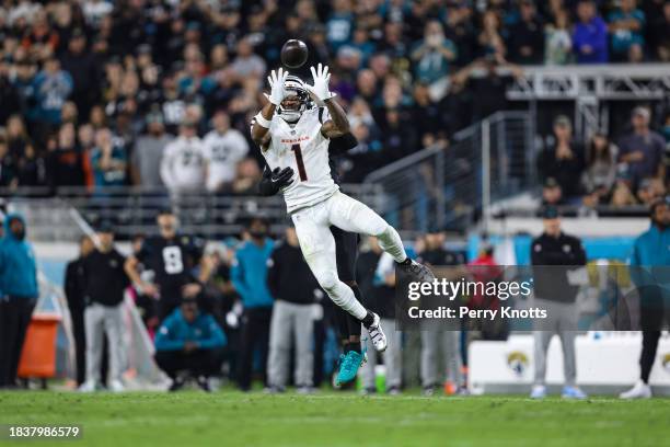 Ja'Marr Chase of the Cincinnati Bengals goes up for the ball during an NFL football game against the Jacksonville Jaguars at EverBank Stadium on...