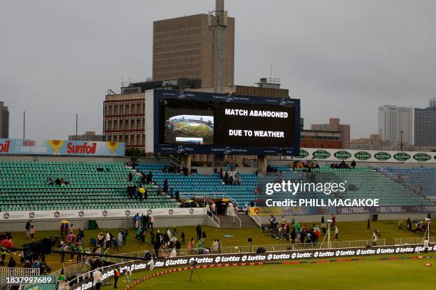 General view of the digital board displaying the message that play has been abanodoned due to rain at the first T20 cricket match between South...