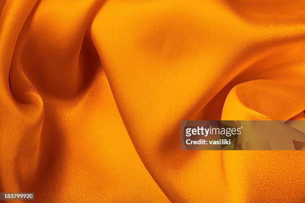 orange yellow satin - orange silk background stock pictures, royalty-free photos & images