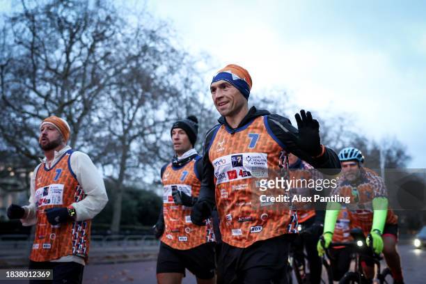 Kevin Sinfield waves to supporters as he Finishes His Ultra 7 In 7 In 7 Marathon Challenge at The Mall In London on December 07, 2023 in London,...