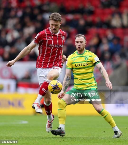 Rob Dickie of Bristol City is challenged by Ashley Barnes of Norwich City during the Sky Bet Championship match between Bristol City and Norwich City...