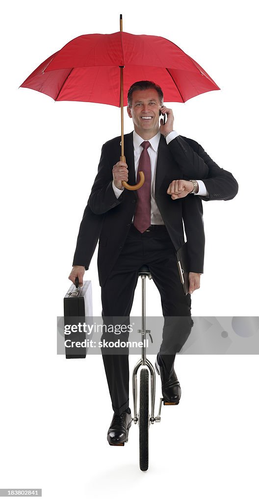 Business Mann Multitasking auf Einrad