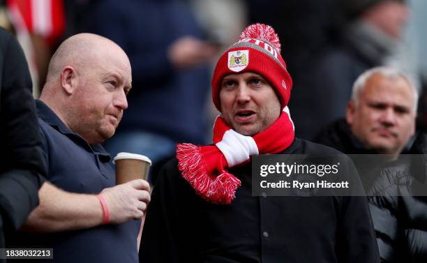 Fan of Bristol City, wearing a scarf and bobble hat, looks on prior to the Sky Bet Championship match between Bristol City and Norwich City at Ashton...