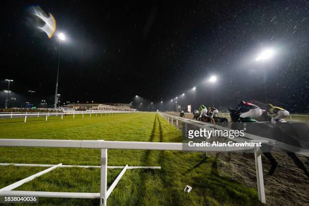 Runners race towards the finish during The Racing Is Everyone's Sport Restricted Maiden Stakes at Chelmsford City Racecourse on December 07, 2023 in...
