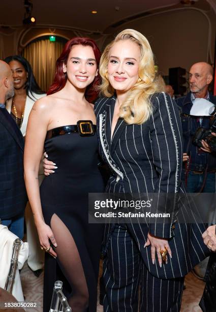 Dua Lipa and Adele attend The Hollywood Reporter's Women in Entertainment 2023 at The Beverly Hills Hotel on December 07, 2023 in Los Angeles,...