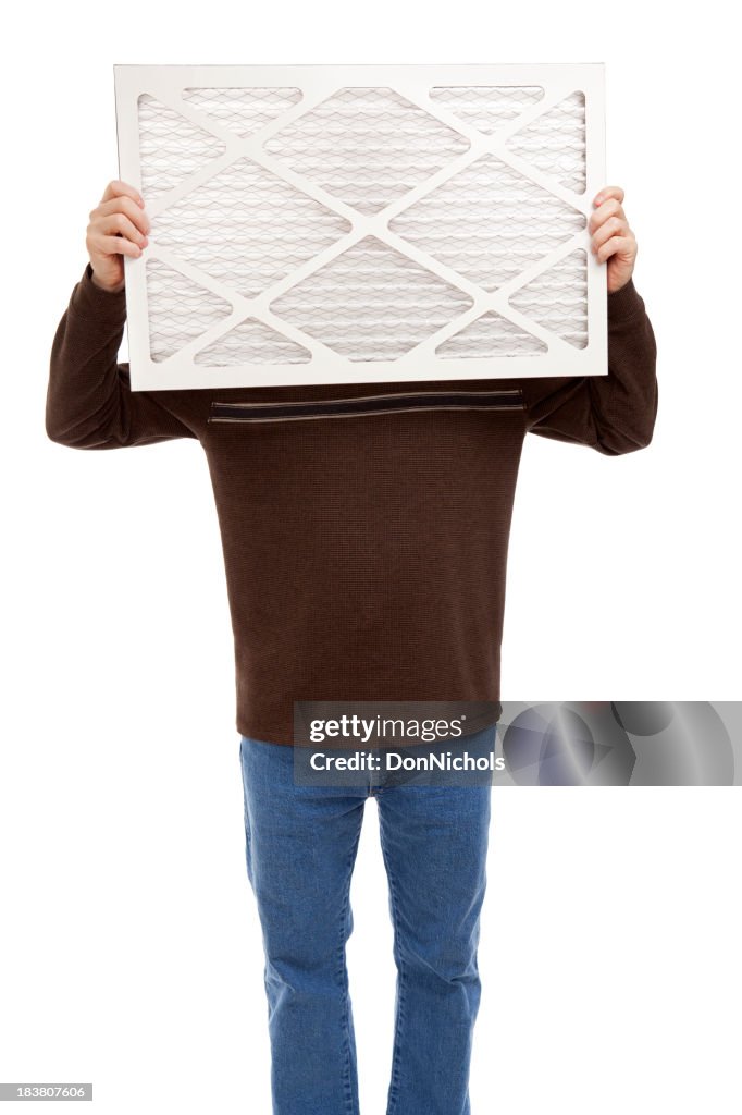 Man Holding a Furnace Air Filter