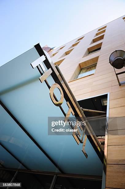 hotel sign over building entrance - entrance sign stock pictures, royalty-free photos & images