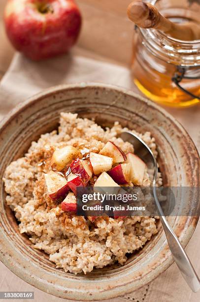 steel cut oatmeal with apple, honey and cinnamon - oatmeal stock pictures, royalty-free photos & images
