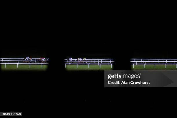 View through the window at the back of the grandstand as Alistair Rawlinson riding Penzance win The Liam Taylor Legacy Handicap at Chelmsford City...