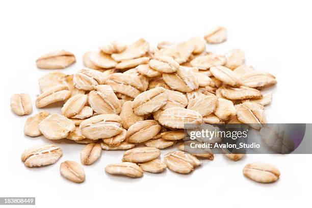 oatmeal on a white background - barley stock pictures, royalty-free photos & images