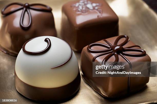 assorted elegant chocolate truffles - chocolate truffle stock pictures, royalty-free photos & images