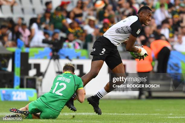 Ireland's Niall Comerford tackles Fiji's Joseva Talacolo during the men's HSBC World Rugby Sevens Series 2023 third place play-off match between...
