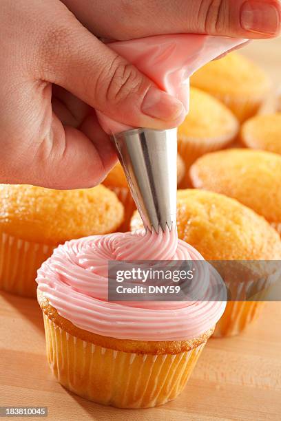 cupcake decorating - cake decorating stock pictures, royalty-free photos & images