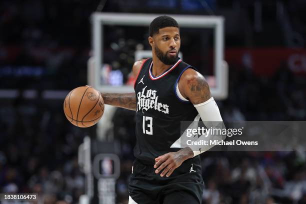 Paul George of the LA Clippers controls the ball against the Denver Nuggets during the second half a game at Crypto.com Arena on December 06, 2023 in...