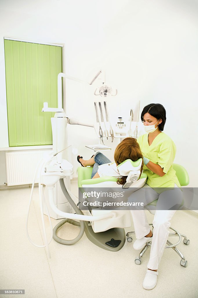 Dentist Office Room View with Patient and Medical Woman