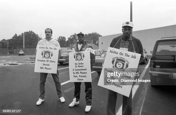 Dan Fike, Kevin Mack and Ozzie Newsome of the Cleveland Browns participate in a NFLPA strike protest at Baldwin Wallace College on September 22, 1987...