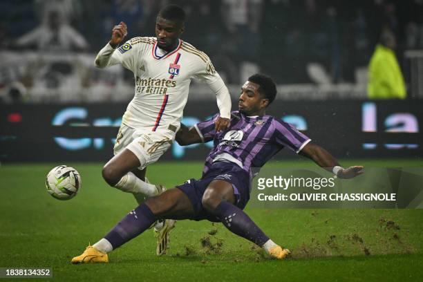 Lyon's Belgium defender Clinton Mata fights for the ball with Toulouse's Cape Verdean defender Logan Costa during the French L1 football match...