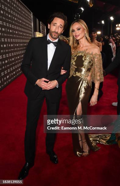 Adrien Brody and Georgina Chapman attend the red carpet on the closing night of the Red Sea International Film Festival 2023 on December 07, 2023 in...